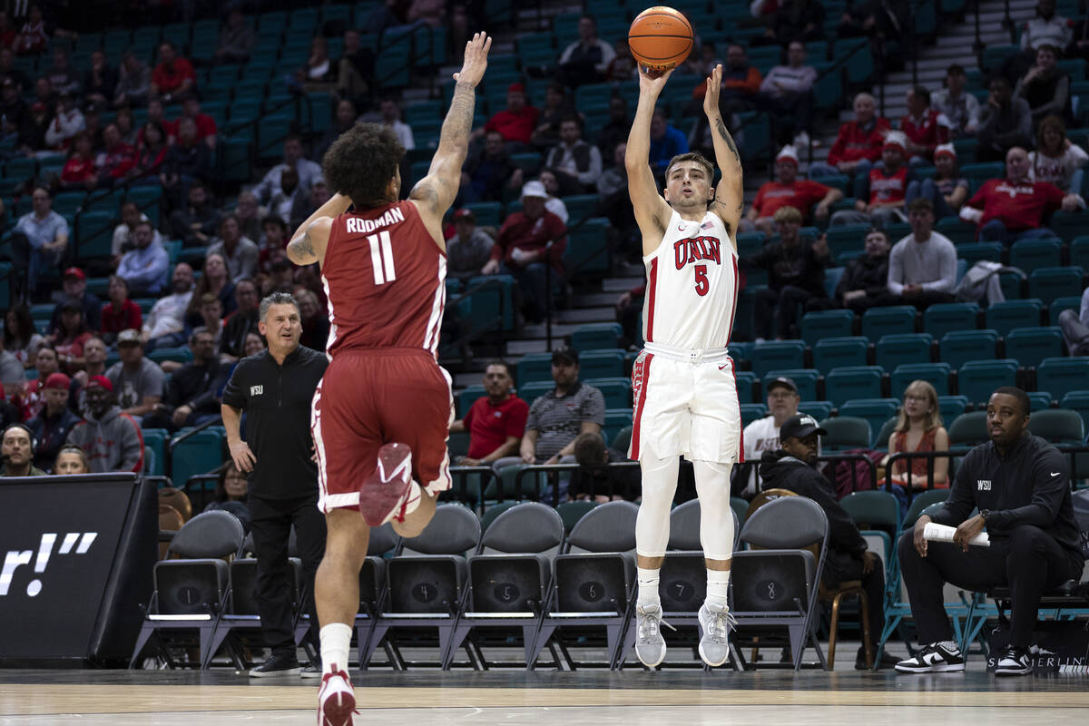 UNLV Rebels guard Jordan McCabe (5) shoots against Washington State Cougars forward DJ Rodman ( ...