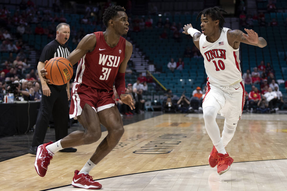 UNLV Rebels guard Keshon Gilbert (10) runs to defend against Washington State Cougars guard Kym ...