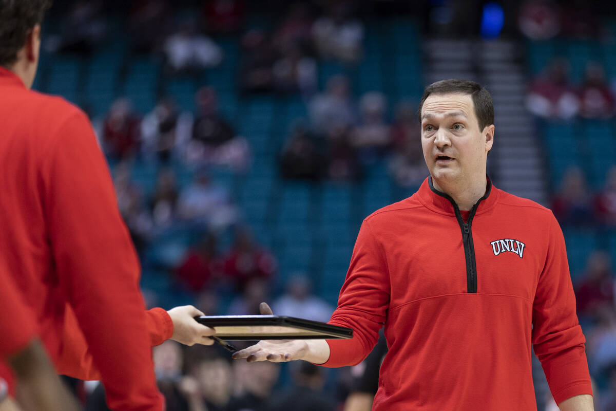 UNLV Rebels head coach Kevin Kruger prepares for a timeout during the second half of an NCAA co ...