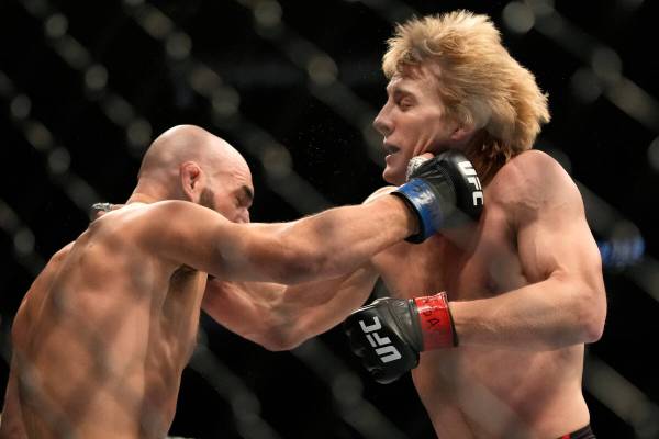 Paddy Pimblett, right, fights Jared Gordon during a UFC 282 mixed martial arts lightweight bout ...