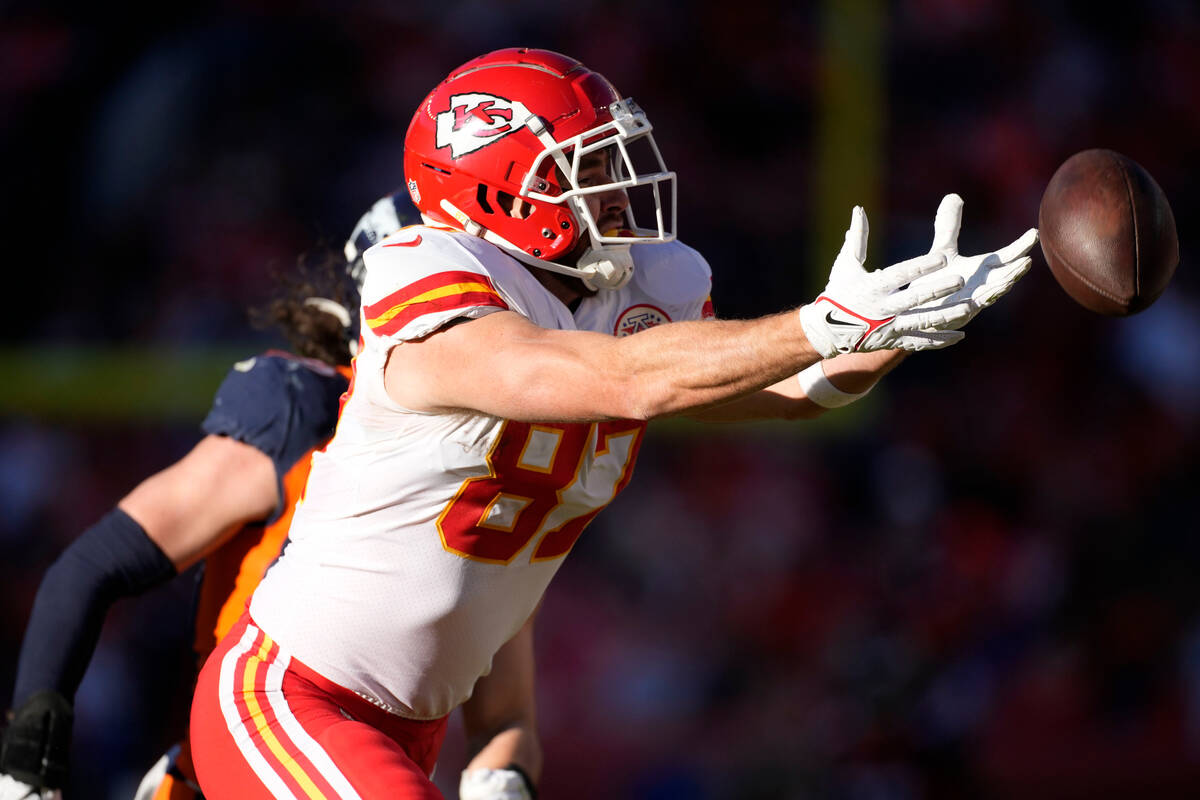 Kansas City Chiefs tight end Travis Kelce misses a catch during the first half of an NFL footba ...