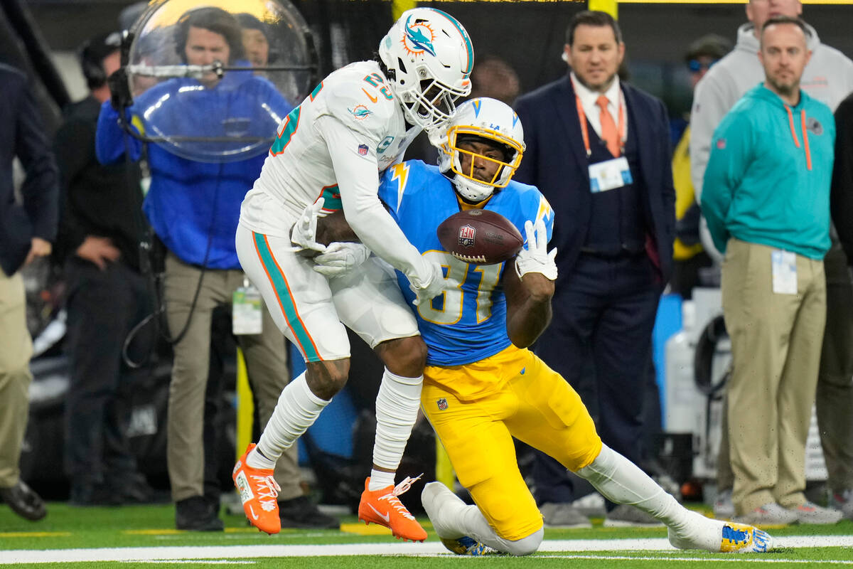 Los Angeles Chargers wide receiver Mike Williams (81) makes a catch over Miami Dolphins cornerb ...