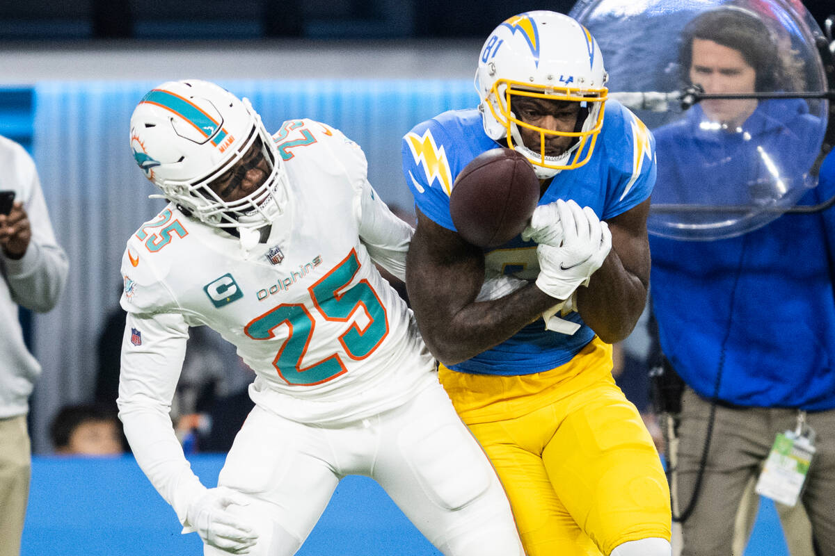 Los Angeles Chargers wide receiver Mike Williams (81) catches a pass over Miami Dolphins corner ...