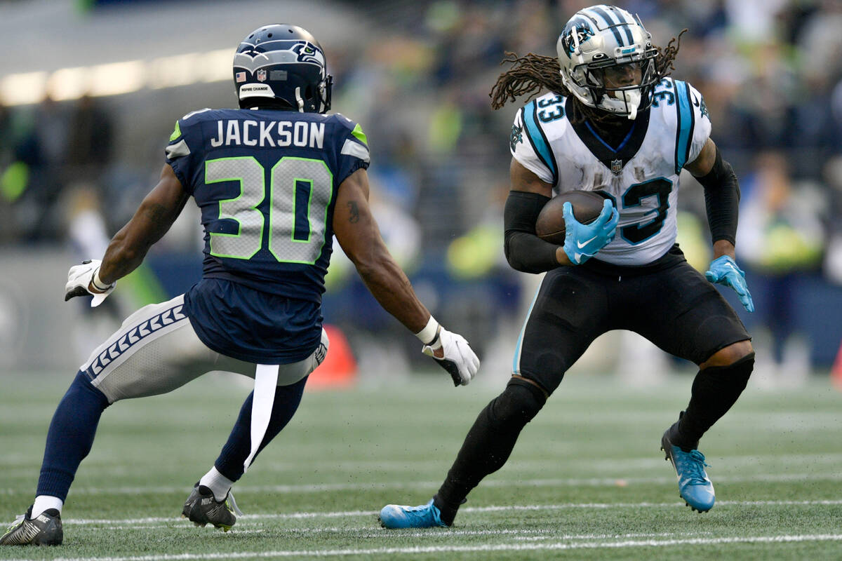 Carolina Panthers running back D'Onta Foreman (33) runs against Seattle Seahawks cornerback Mik ...