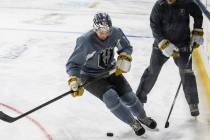 Henderson Silver Knights’ defenseman Brayden Pachal (94) skates with the puck under the ...