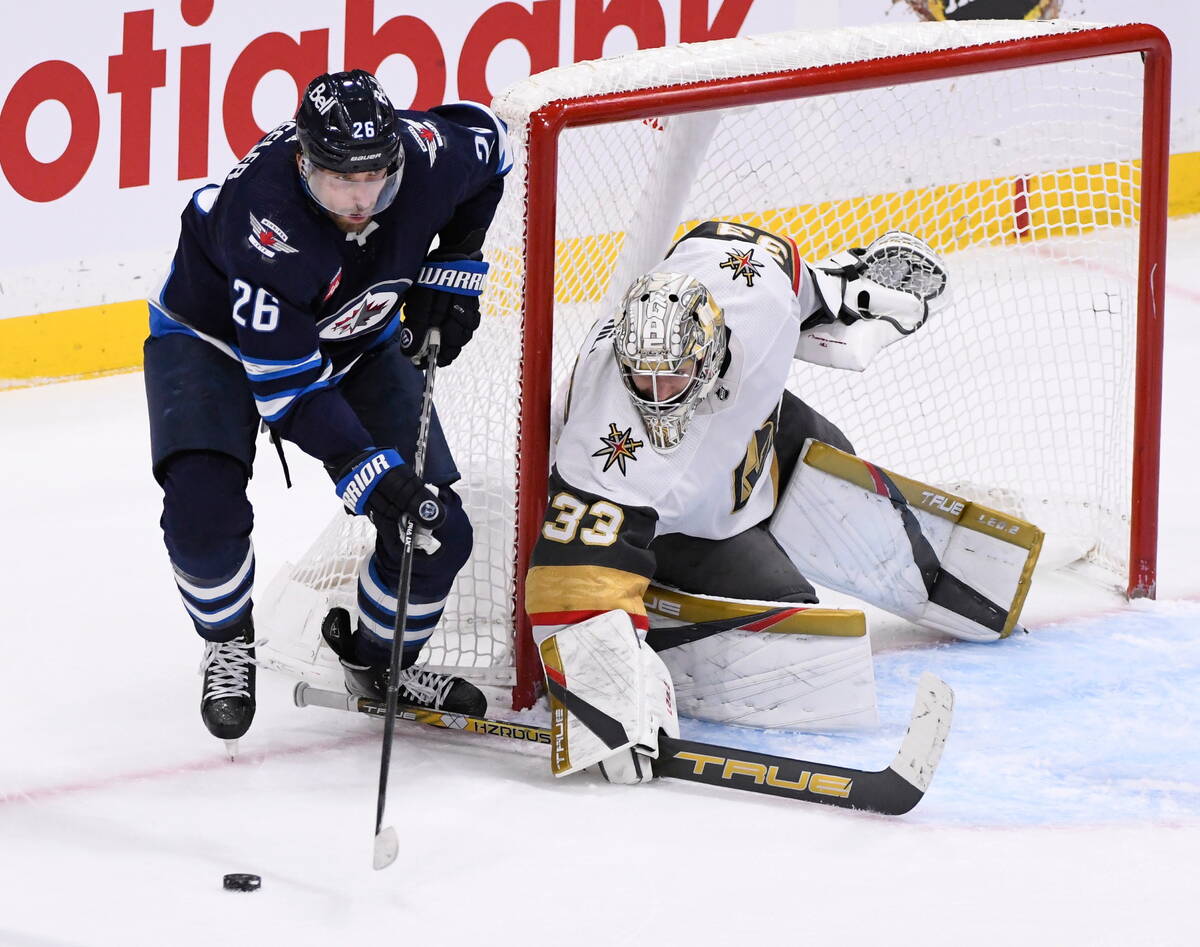 Winnipeg Jets' Blake Wheeler (26) looks to pass the puck in front of Vegas Golden Knights goalt ...