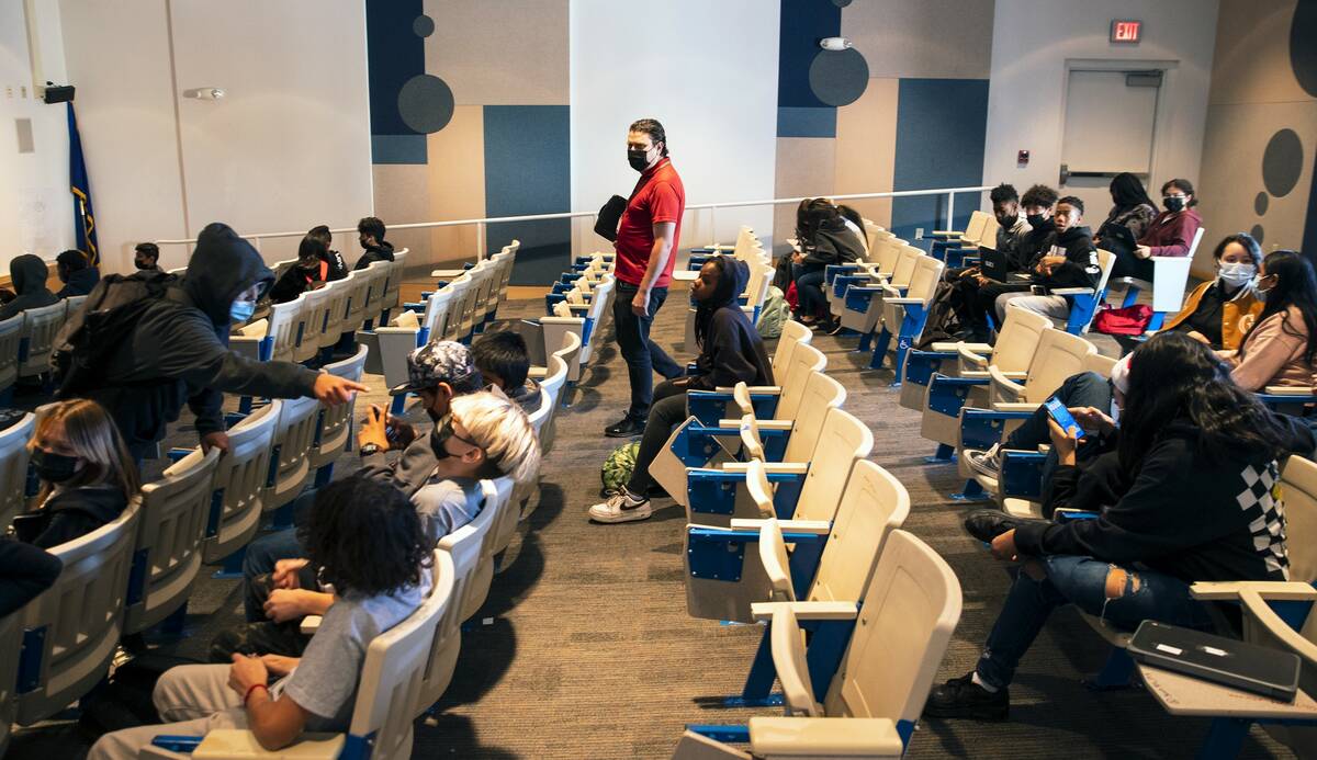 Zackery Kimball, a substitute teacher at Bailey Middle School, works with two classes at the sc ...