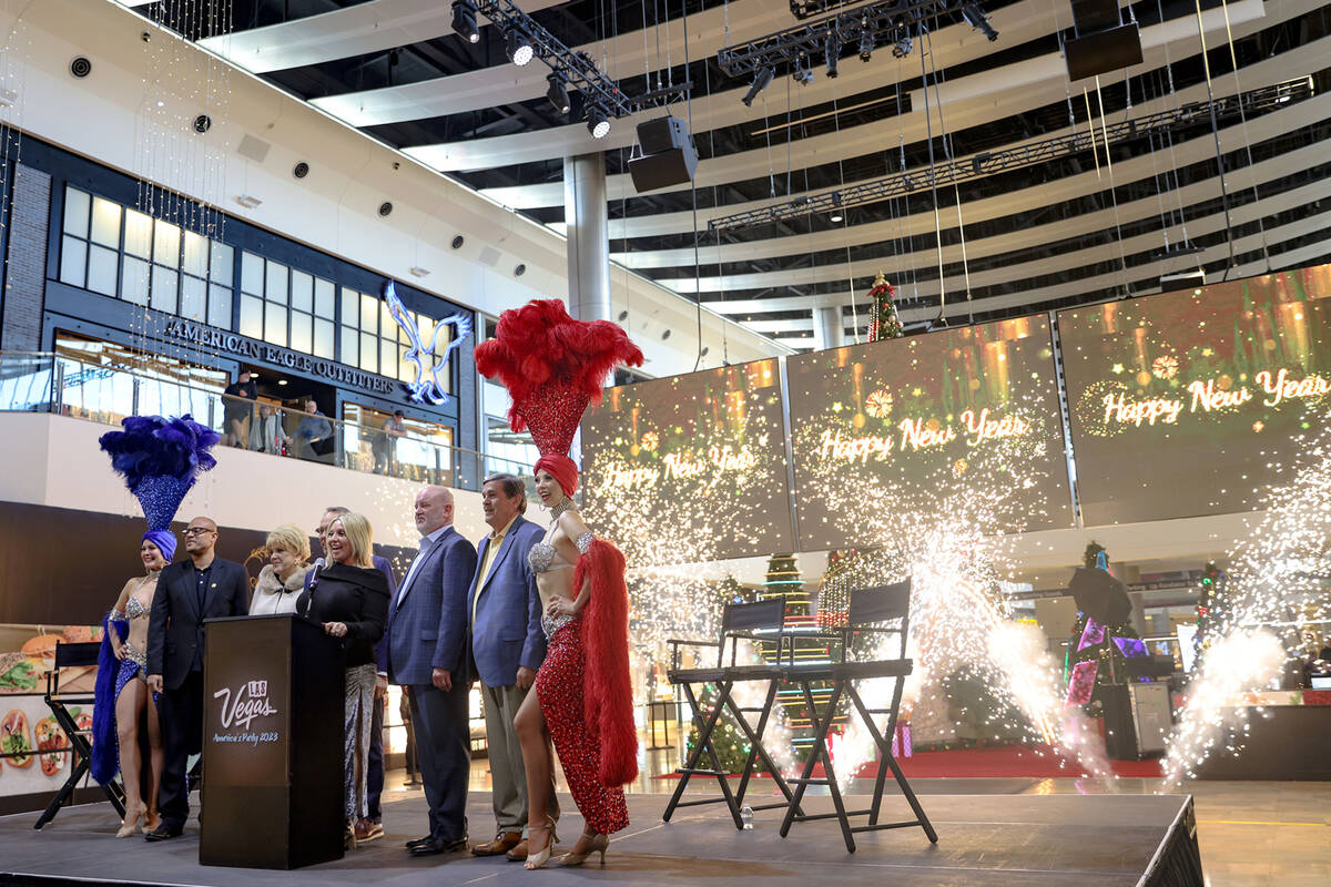 City and county officials pose in front of fireworks at an event to announce the city’s ...