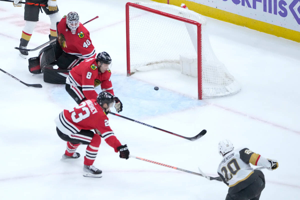 Vegas Golden Knights' Chandler Stephenson (20) watches his shot score past Chicago Blackhawks' ...