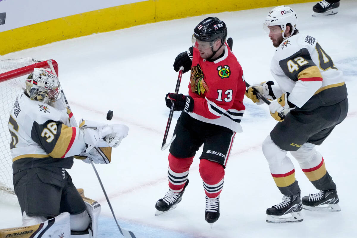 Vegas Golden Knights goaltender Logan Thompson makes a glove save on a shot by Chicago Blackhaw ...