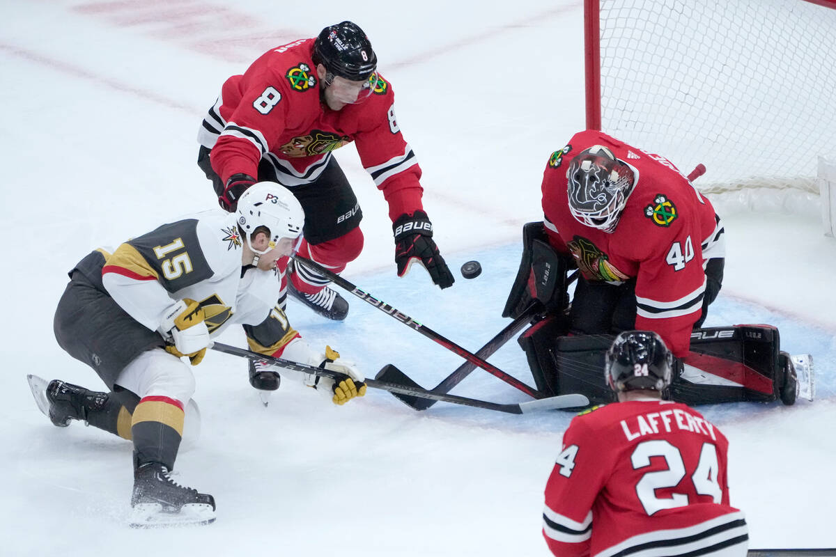 Chicago Blackhawks goaltender Arvid Soderblom (40) makes a pad save on a backhand shot by Vegas ...