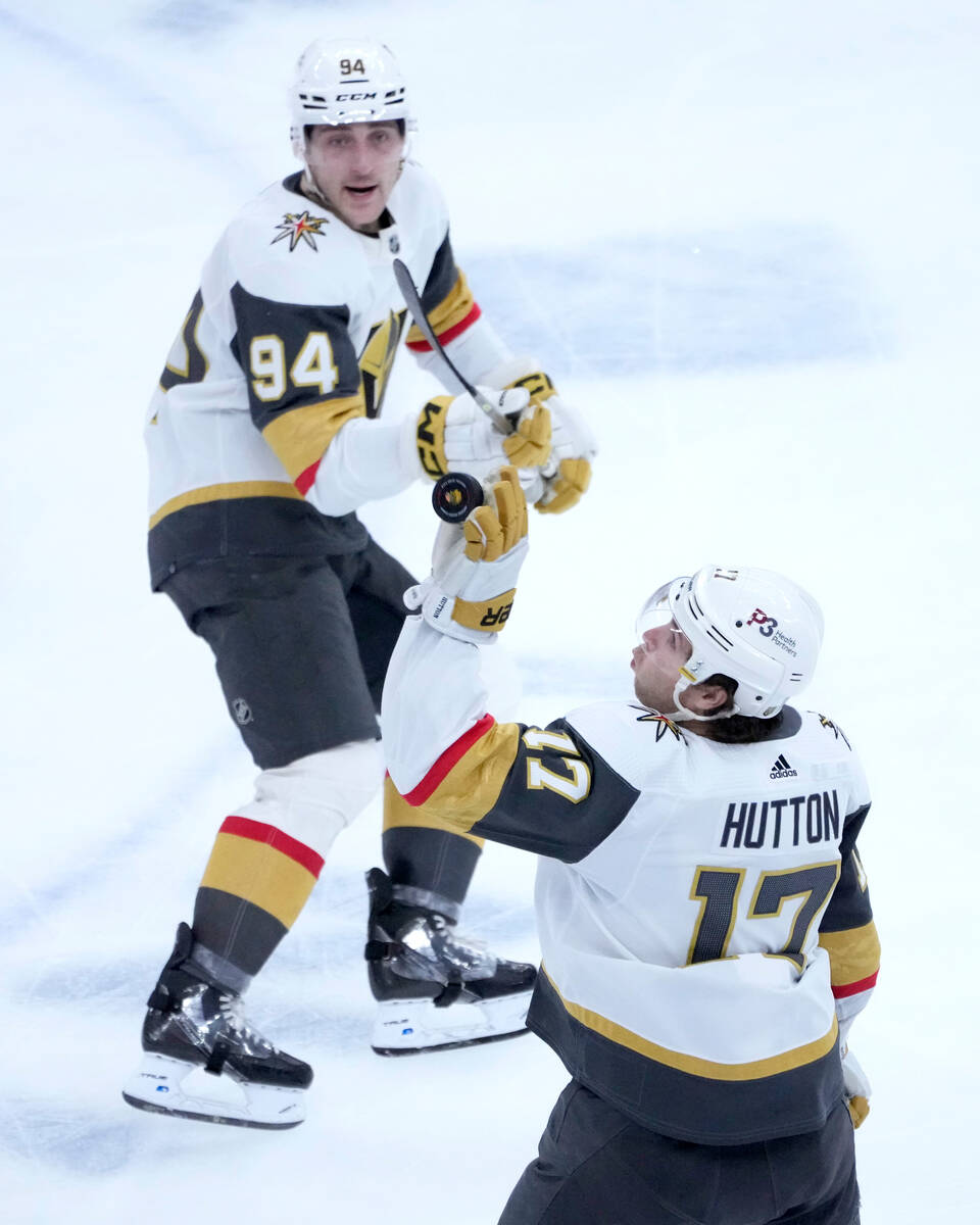 Vegas Golden Knights' Ben Hutton (17) knocked down an airborne puck as Brayden Pachal watches d ...