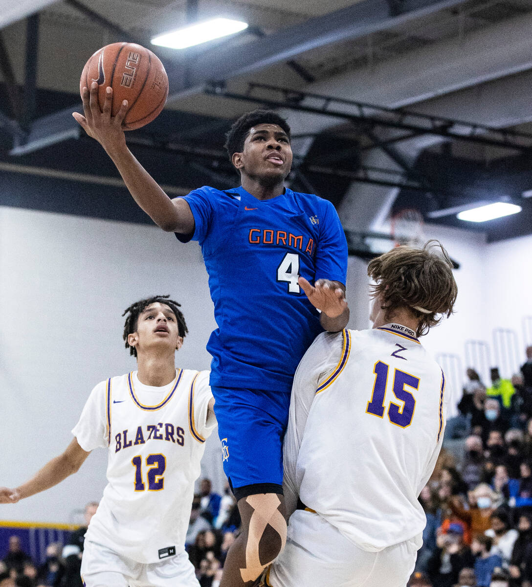 Bishop Gorman’s Jase Richardson (4) goes for the hoop between Durango high’s Mason Brown (1 ...