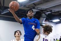 Bishop Gorman’s Jase Richardson (4) goes for the hoop between Durango high’s Mason Brown (1 ...