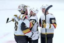 Vegas Golden Knights goaltender Logan Thompson (36) Alec Martinez, and Brayden Pachal celebrate ...