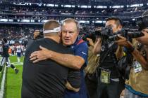 New England Patriots Head Coach Bill Belichick hugs Raiders Head Coach Josh McDaniels on the fi ...