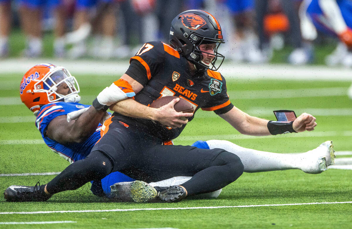 Oregon State Beavers quarterback Ben Gulbranson (17) is sacked by Florida Gators defensive line ...