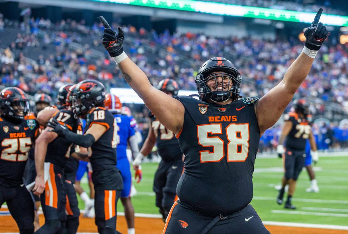 Oregon State Beavers offensive lineman Heneli Bloomfield (58) celebrates another team score ove ...