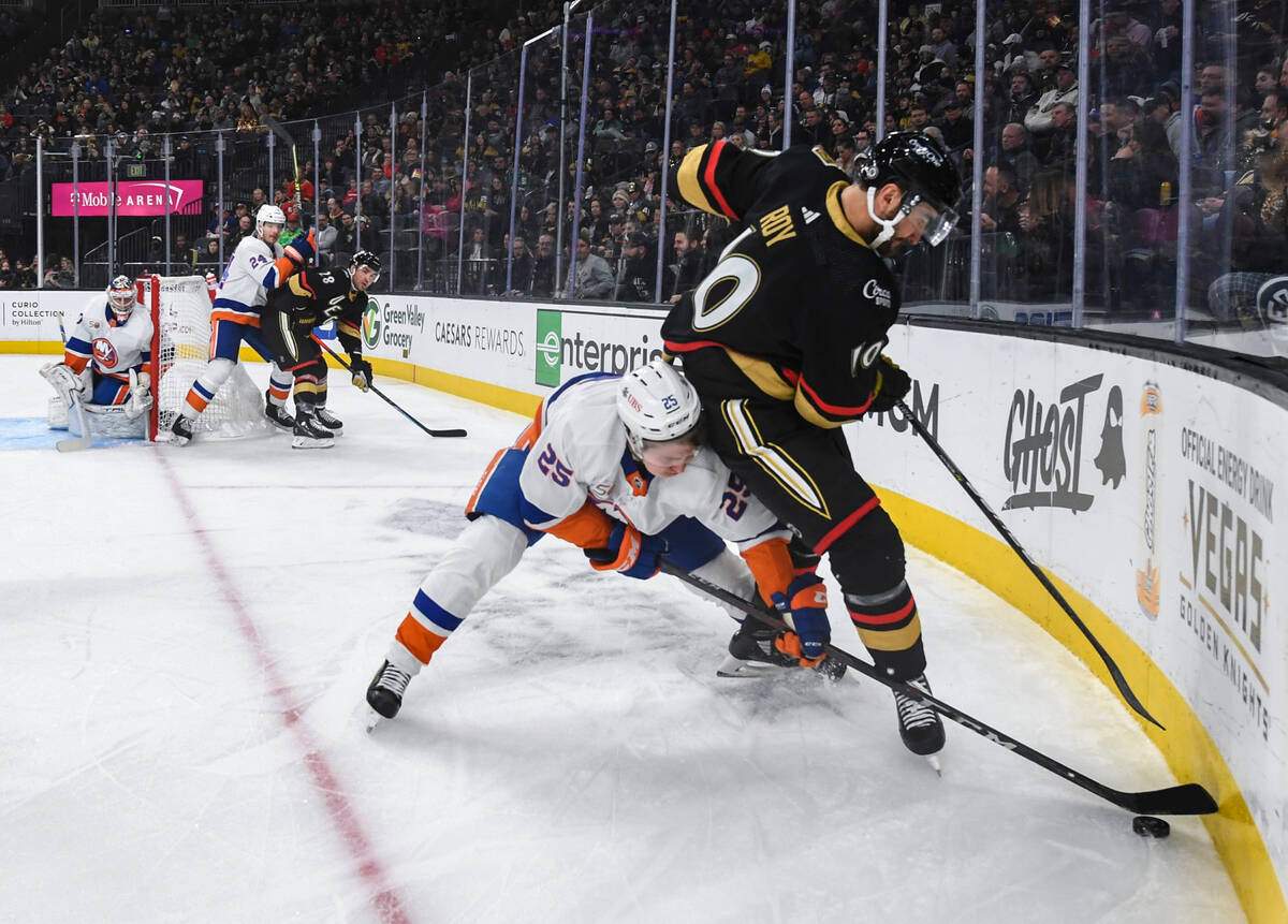 New York Islanders defenseman Sebastian Aho (25) and Vegas Golden Knights center Nicolas Roy (1 ...