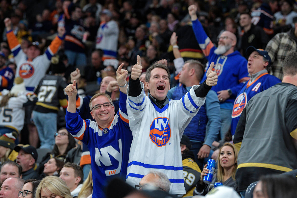 New York Islanders fans cheer and taunt Vegas Golden Knights fans after scoring during the seco ...