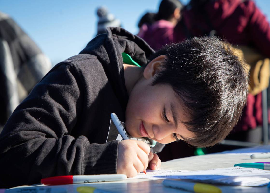 Diego Rodriguez, 7, writes a letter to Santa during the Las Vegas Rescue Mission’s 13th ...