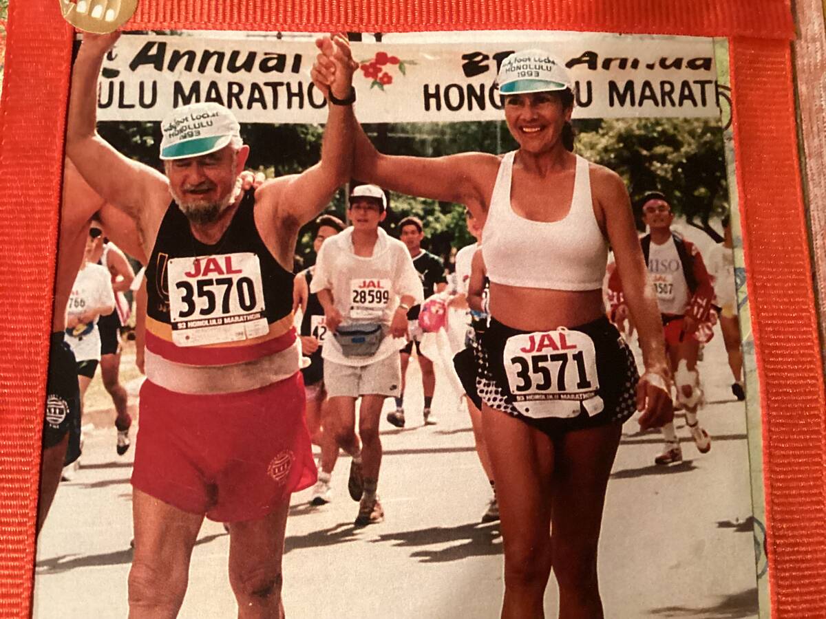 Vincent Shank crosses the finish line after completing a marathon in Honolulu, Hawaii. (Nancy S ...