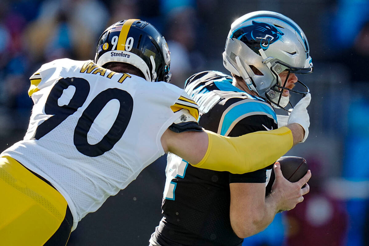 Carolina Panthers quarterback Sam Darnold is sacked by Pittsburgh Steelers linebacker T.J. Watt ...