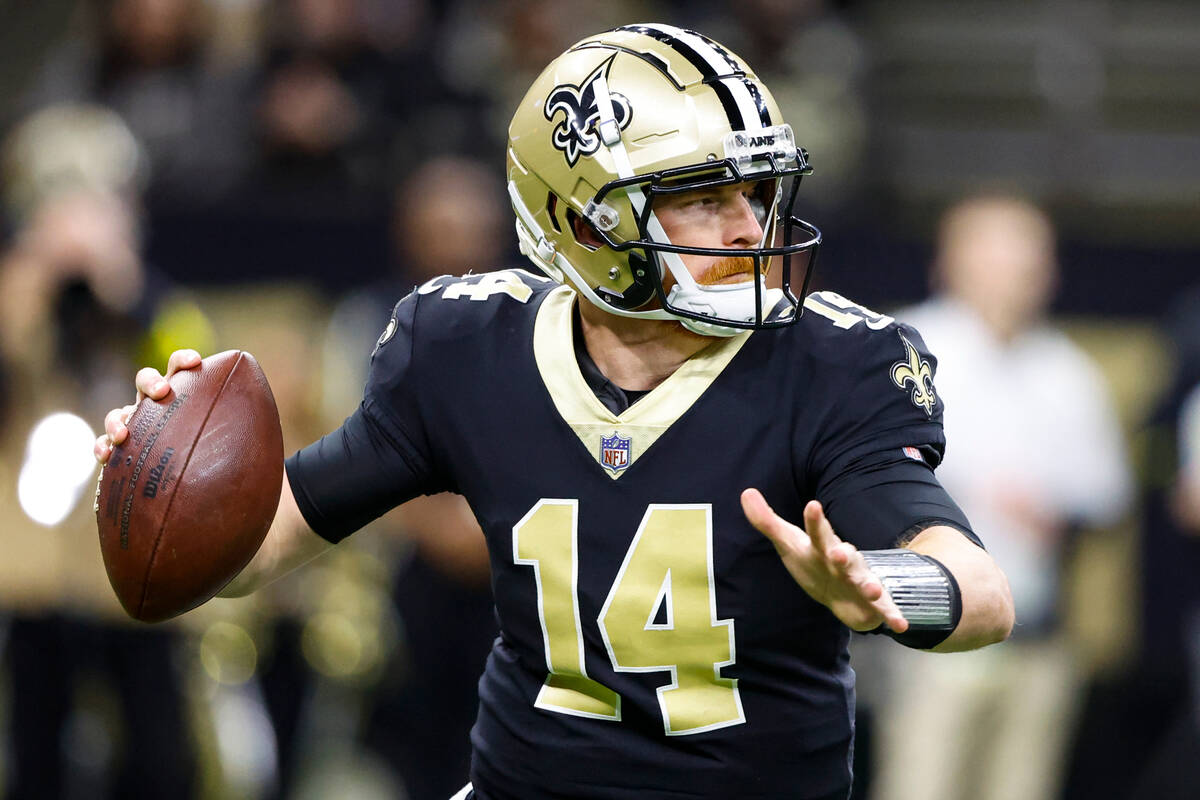 New Orleans Saints quarterback Andy Dalton (14) throws against the Atlanta Falcons In the first ...