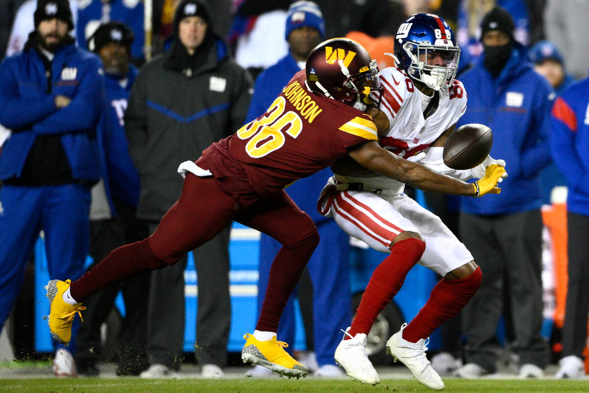 Washington Commanders cornerback Danny Johnson (36) defends against New York Giants wide receiv ...