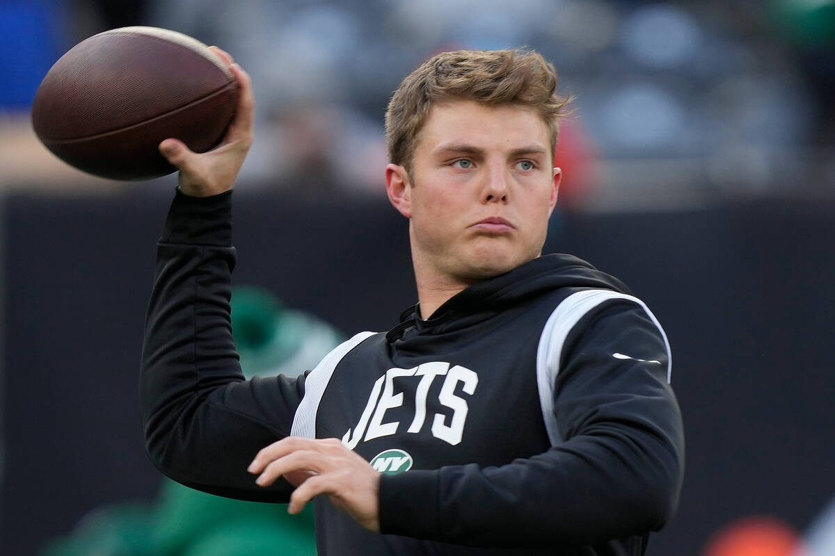 New York Jets quarterback Zach Wilson warms up before playing against the Detroit Lions in an N ...