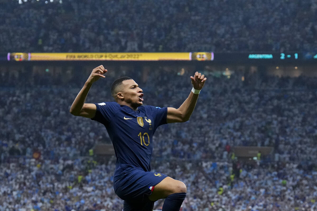 France's Kylian Mbappe celebrates scoring his side's second goal during the World Cup final soc ...