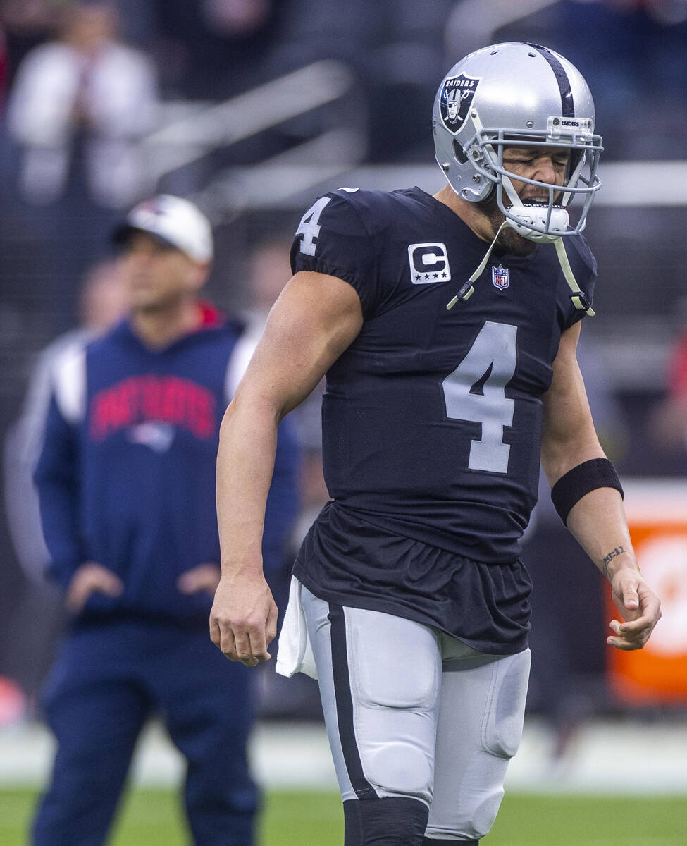 Raiders quarterback Derek Carr (4) yells on the field during warm ups before the first half of ...