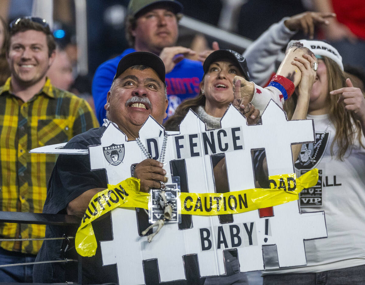 Raiders fans get pumped versus the New England Patriots during the second half of their NFL gam ...