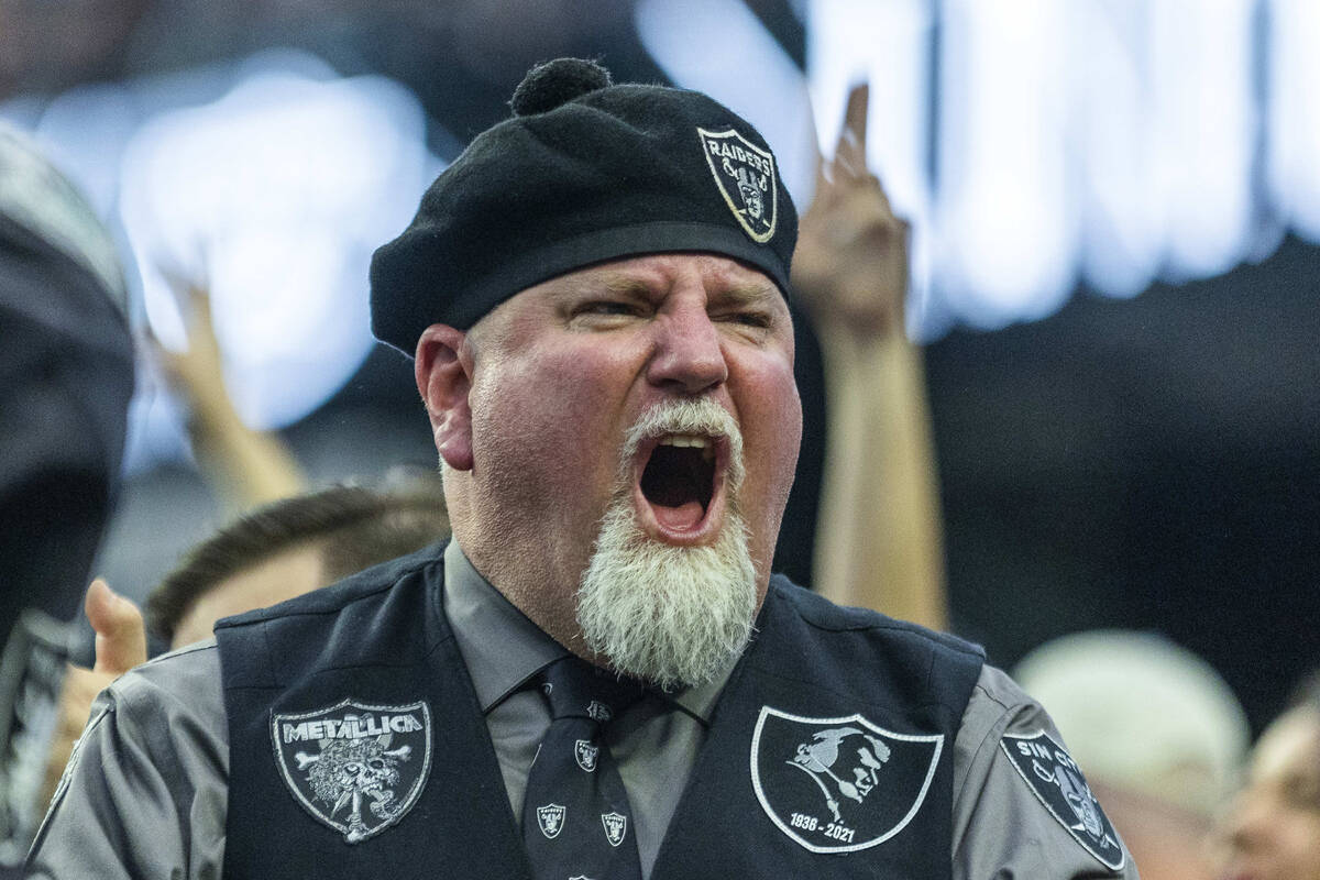 A Raiders fan pumps up others versus the New England Patriots during the first half of their NF ...