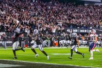 Raiders defensive end Chandler Jones (55) celebrates as he scores a game-winning touchdown over ...