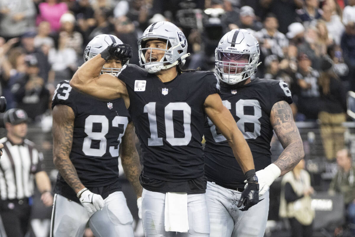 Raiders wide receiver Mack Hollins (10) flexes after scoring a touchdown during the first half ...