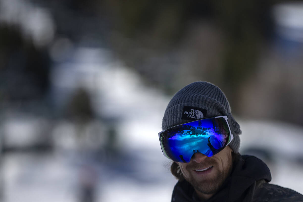 Christopher Lewis, of Las Vegas, smiles as he reaches the bottom of Rabbit Peak during opening ...