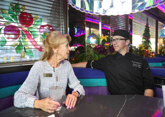 Peggy Orth, general manager of the Peppermill, talks with her son, Nicholas Orth, who is the ex ...