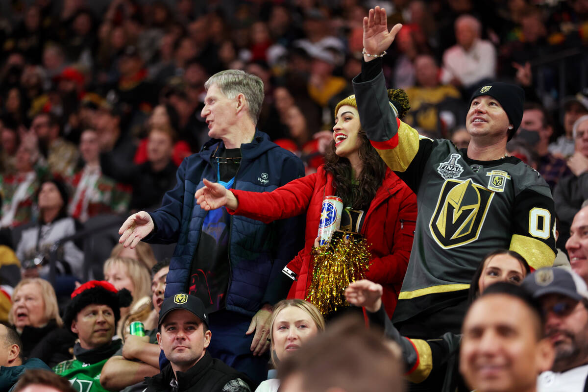 Fans cheer during the first period of an NHL hockey game between the Arizona Coyotes and the Ve ...