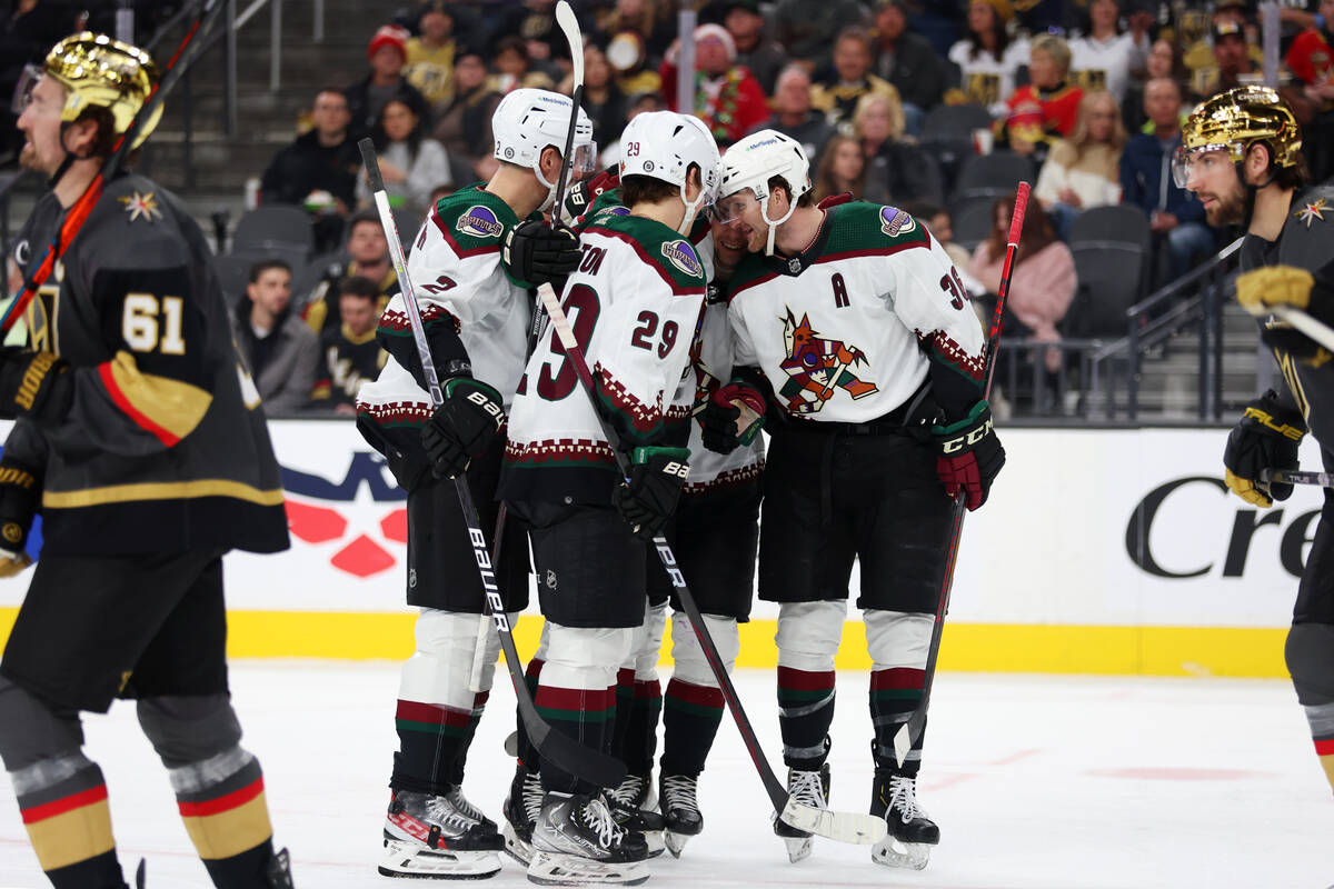 The Arizona Coyotes celebrate a score by defenseman Juuso Valimaki (4) during the second period ...