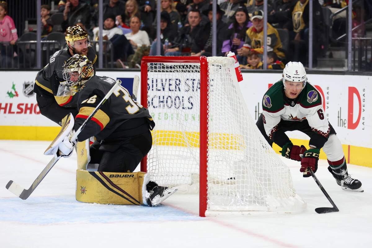 Vegas Golden Knights goaltender Logan Thompson (36) watches Arizona Coyotes defenseman Jakob Ch ...