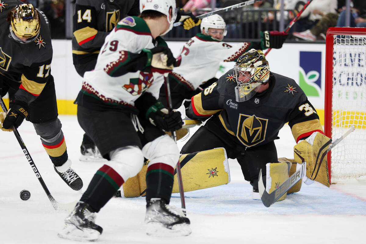 Vegas Golden Knights goaltender Logan Thompson (36) defends the goal against the Arizona Coyote ...