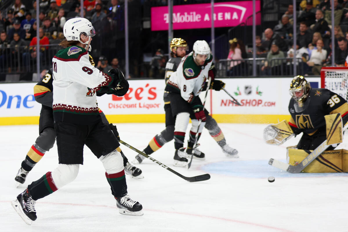 Arizona Coyotes right wing Clayton Keller (9) takes a shot at Vegas Golden Knights goaltender L ...