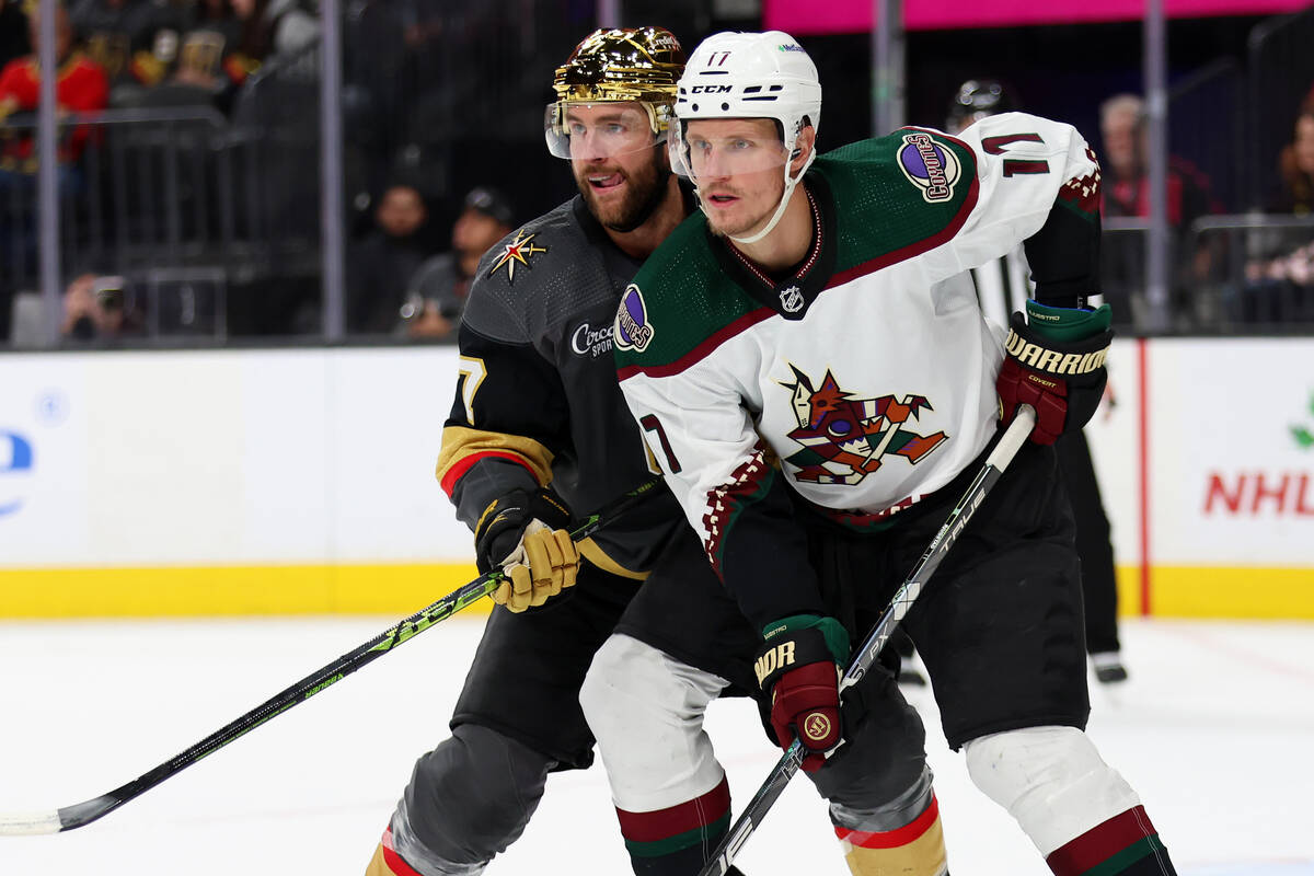 Vegas Golden Knights defenseman Alex Pietrangelo (7) defends against Arizona Coyotes center Nic ...