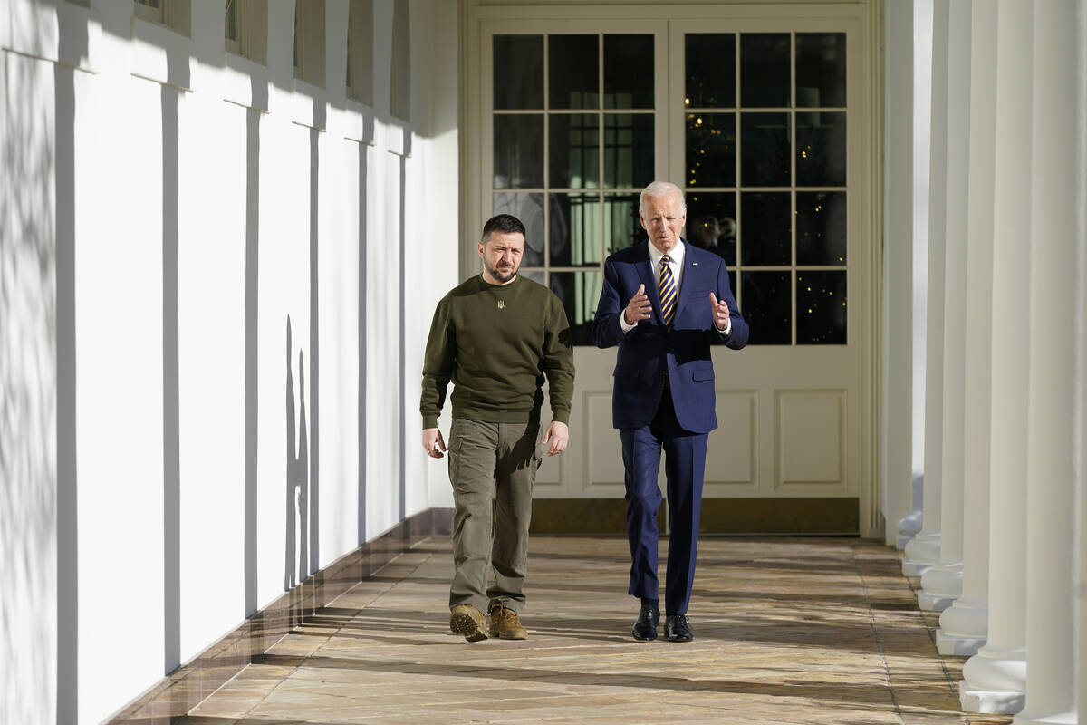 President Joe Biden and Ukrainian President Volodymyr Zelenskyy walk along the Colonnade of the ...