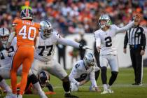 Raiders place kicker Daniel Carlson (2) watches as he kicks a field goal during the second half ...