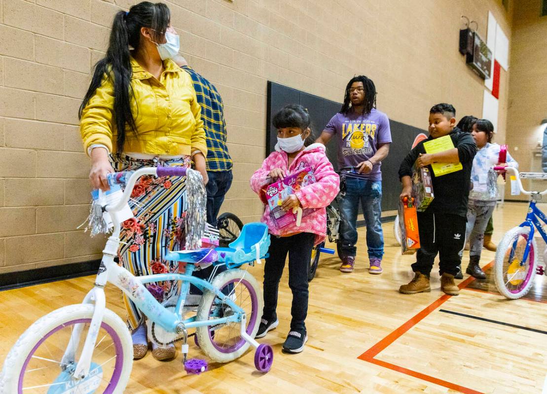 Pamela Garcia Olivia, 5, leaves Pearson Community Center with her mother Valeria after receivin ...