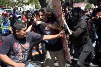 FILE- In this Aug. 27, 2017, file photo, demonstrators clash during a free speech rally in Berk ...