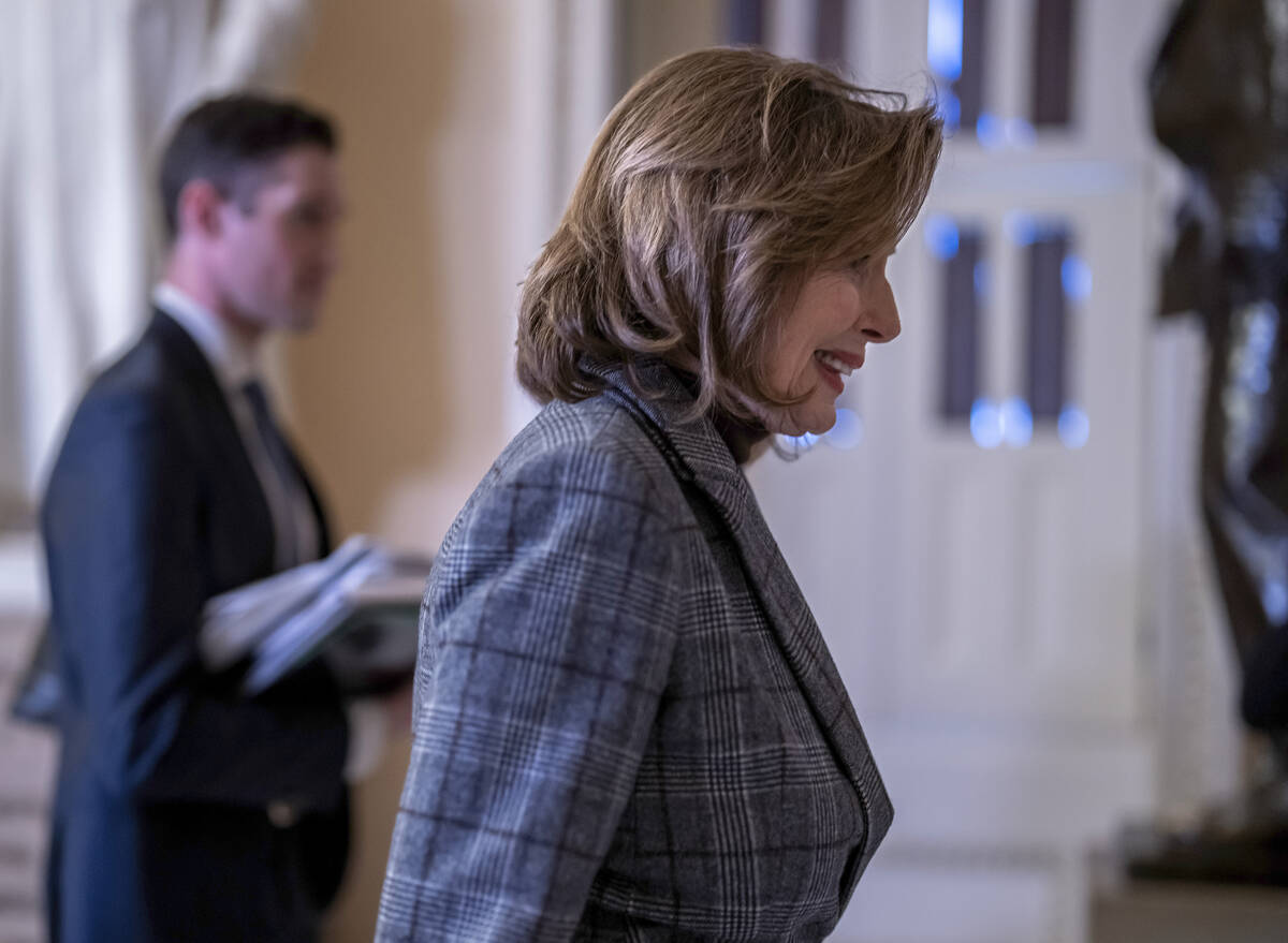 Speaker of the House Nancy Pelosi, D-Calif., leaves the chamber as the final votes of the 117th ...