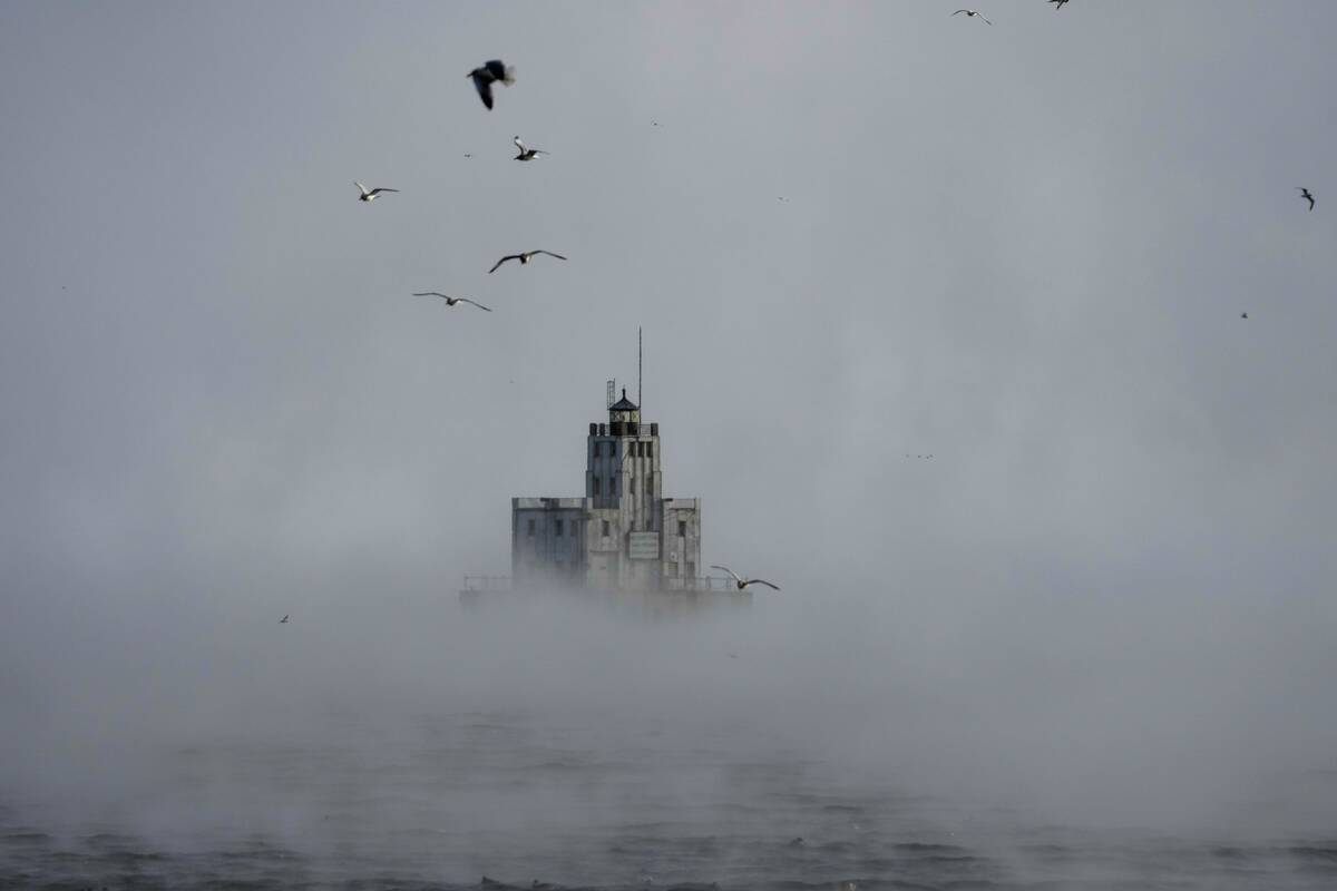 Steam rises off of Lake Michigan as morning temperatures remain below zero with heavy winds Fri ...